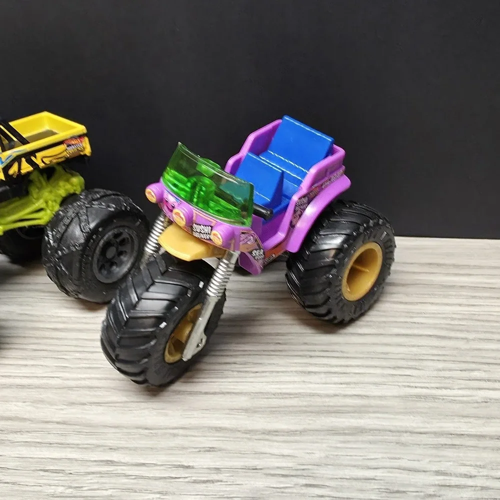 Hotwheels Monster Trucks Lot - Carbonator, Buns Of Steel, Unimog, And Tuk N Roll